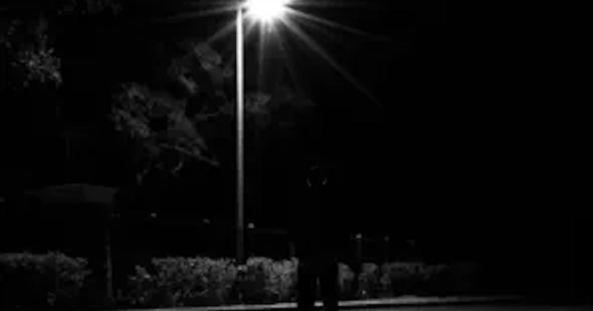 person standing on a dark street