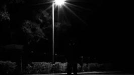 person standing on a dark street